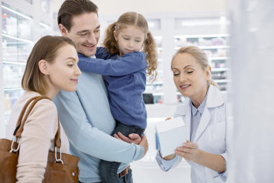 adorable family listening to female pharmacist